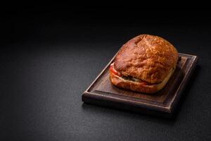 Ciabata with jamon or prosciutto, tomatoes, cheese and lettuce photo