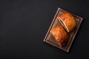 Ciabata with jamon or prosciutto, tomatoes, cheese and lettuce photo