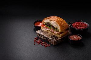 Ciabata with jamon or prosciutto, tomatoes, cheese and lettuce photo