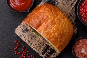 Ciabata with jamon or prosciutto, tomatoes, cheese and lettuce photo