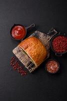 Ciabata with jamon or prosciutto, tomatoes, cheese and lettuce photo