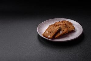 Brown bread with seeds, grains, salt and spices photo