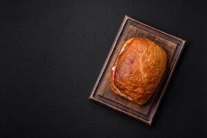 Ciabata with jamon or prosciutto, tomatoes, cheese and lettuce photo