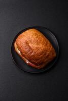 Ciabata with jamon or prosciutto, tomatoes, cheese and lettuce photo