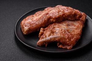 Pork ribs in sweet and sour sauce with salt and spices photo