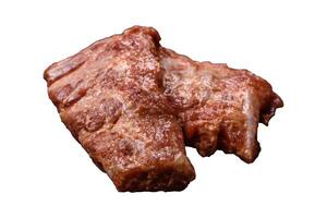 Pork ribs in sweet and sour sauce with salt and spices photo