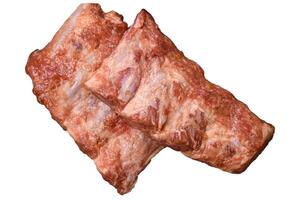 Pork ribs in sweet and sour sauce with salt and spices photo