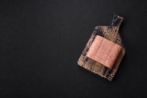 Delicious canned pink spiced ham or spam with salt, spices and herbs photo
