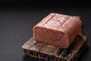 Delicious canned pink spiced ham or spam with salt, spices and herbs photo