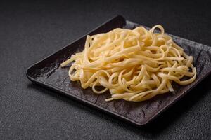 Rice noodles with beans, meat, tomato sauce, spices and herbs photo