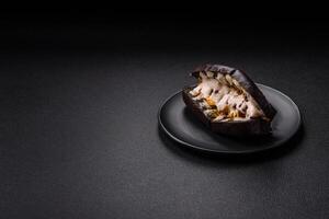 Sandwich with brioche bun, roast beef and vitello tonato sauce photo