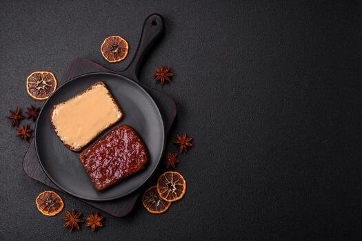 Sandwiches with toast bread, peanut butter and raspberry or strawberry jam photo