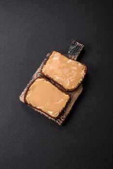 Sandwiches with toast bread, peanut butter and raspberry or strawberry jam photo