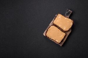 Sandwiches with toast bread, peanut butter and raspberry or strawberry jam photo