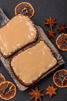 Sandwiches with toast bread, peanut butter and raspberry or strawberry jam photo