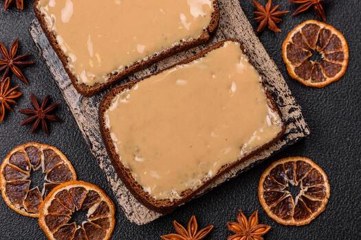 Sandwiches with toast bread, peanut butter and raspberry or strawberry jam photo