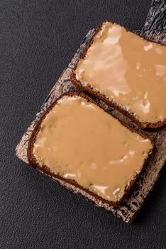 Sandwiches with toast bread, peanut butter and raspberry or strawberry jam photo