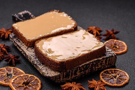 Sandwiches with toast bread, peanut butter and raspberry or strawberry jam photo