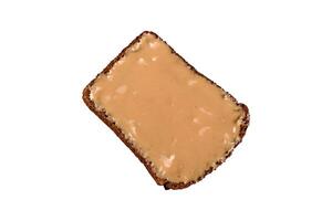 Sandwiches with toast bread, peanut butter and raspberry or strawberry jam photo