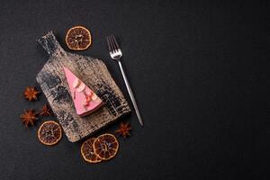 Piece of sweet cheesecake with pink cream cheese of raspberry or strawberry flavor photo