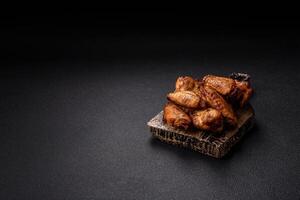 Grilled chicken wings with salt, spices and herbs photo