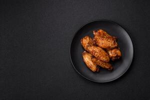 Grilled chicken wings with salt, spices and herbs photo