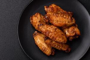 Grilled chicken wings with salt, spices and herbs photo