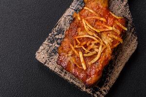 Pork or beef ribs with salt, spices and herbs baked on the grill photo
