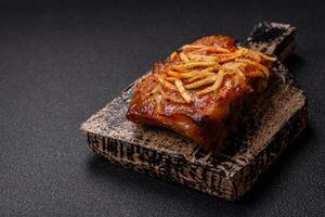 Pork or beef ribs with salt, spices and herbs baked on the grill photo