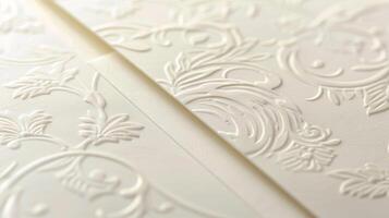 A closeup of a set of embossed thank you cards featuring a dainty vine design in the corner. The design is raised and adds a subtle but elegant touch to the simple stationery photo