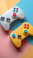 Two game controllers, one white and one yellow, are placed on a colorful background. The controllers are positioned in a way that they appear to be in a game. photo