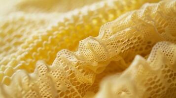The tightly woven cotton fabric of the beeswax wrap is captured in this image with visible fibers and a soft natural texture that makes it ideal for food storage photo
