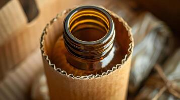A cardboard sleeve snugly hugs a glass bottle displaying the companys commitment to sustainable packaging practices photo