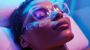 A person lounges in a recliner while receiving a cryotherapy facial with their skin visibly glowing and refreshed after the session photo