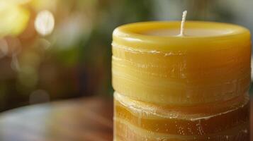 A closeup of a handdipped pillar candle giving a glimpse of the layers of beeswax bayberry wax and essential oils used to create this custom blend photo