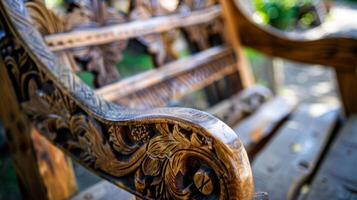 The detailed carving and natural knots of a rustic wooden rocking chair adding character and charm to the piece photo