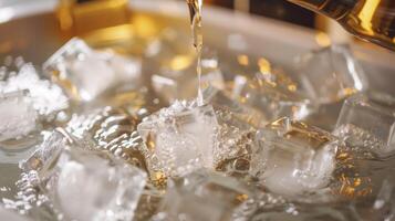 A closeup of ice cubes being poured into a bath tub filled with cold water and essential oils photo