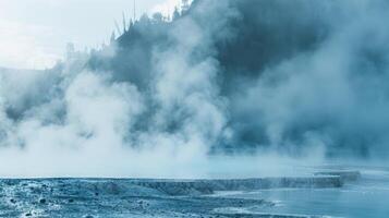 Mist rising from a hot spring blending into the cool morning air and creating a surreal and tranquil setting for visitors photo