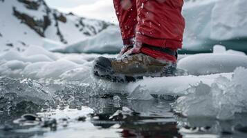Carefully lowering feet into the icy water preparing for the full submersion photo