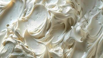 A closeup of a soft whipped body butter with visible specks of shea butter cocoa butter and coconut oil all blending together to create a rich and creamy texture photo