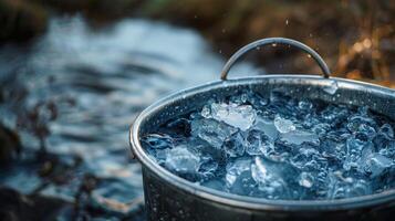 A large bucket filled with cold water and ice ready for use during a rigorous session photo