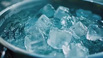 Ice cubes floating in a tub of water ready to provide a chill during an ice bath detox session photo