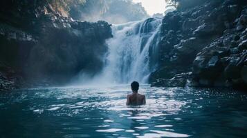 A hidden waterfall in the heart of the city its misty waters inviting those brave enough to take a dip photo