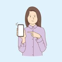 Happy woman points with index finger at blank screen shows modern device isolated over light blue vector