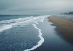 Tranquil Ocean Waves Meeting Sandy Shore photo