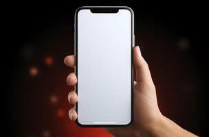 Hand holding an iphone xr mockup on a black background photo
