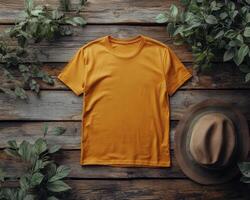 An orange t - shirt and hat on a wooden background photo