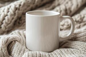 White Mug on Soft Knitted Blanket Cozy Winter photo