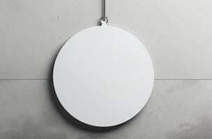 Blank Round Sign Hanging on Gray Wall photo