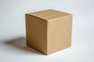 Simple Brown Cardboard Box On White Background. The box is square and has a textured surface. photo